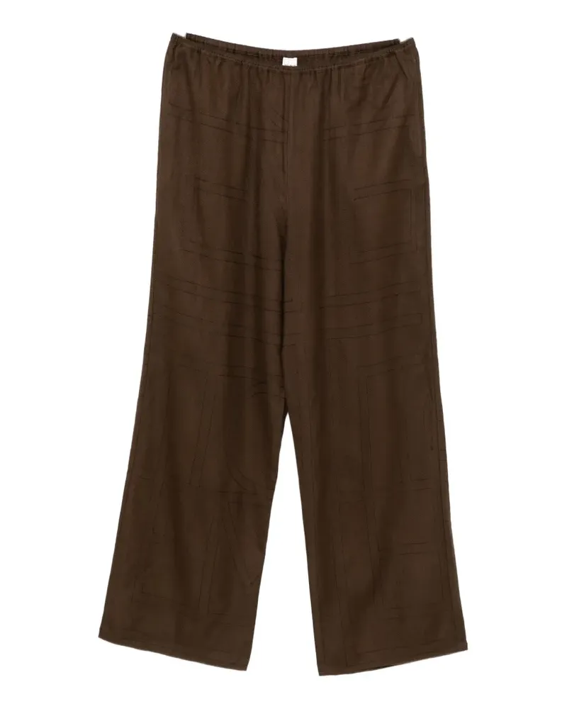 Totême Hose mit Monogramm-Print - Braun Braun