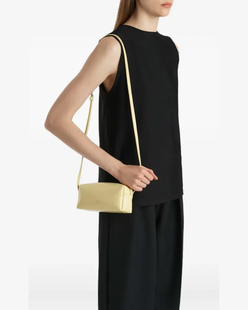 KHAITE mini Kye crossbody bag in pale-yellow crackle-patent leather - Gelb Gelb