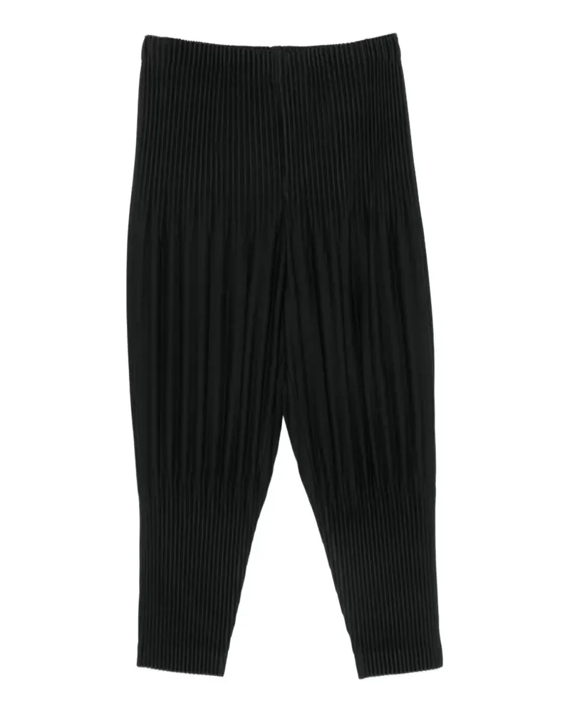 Issey Miyake plissé-effect tapered trousers - Schwarz Schwarz