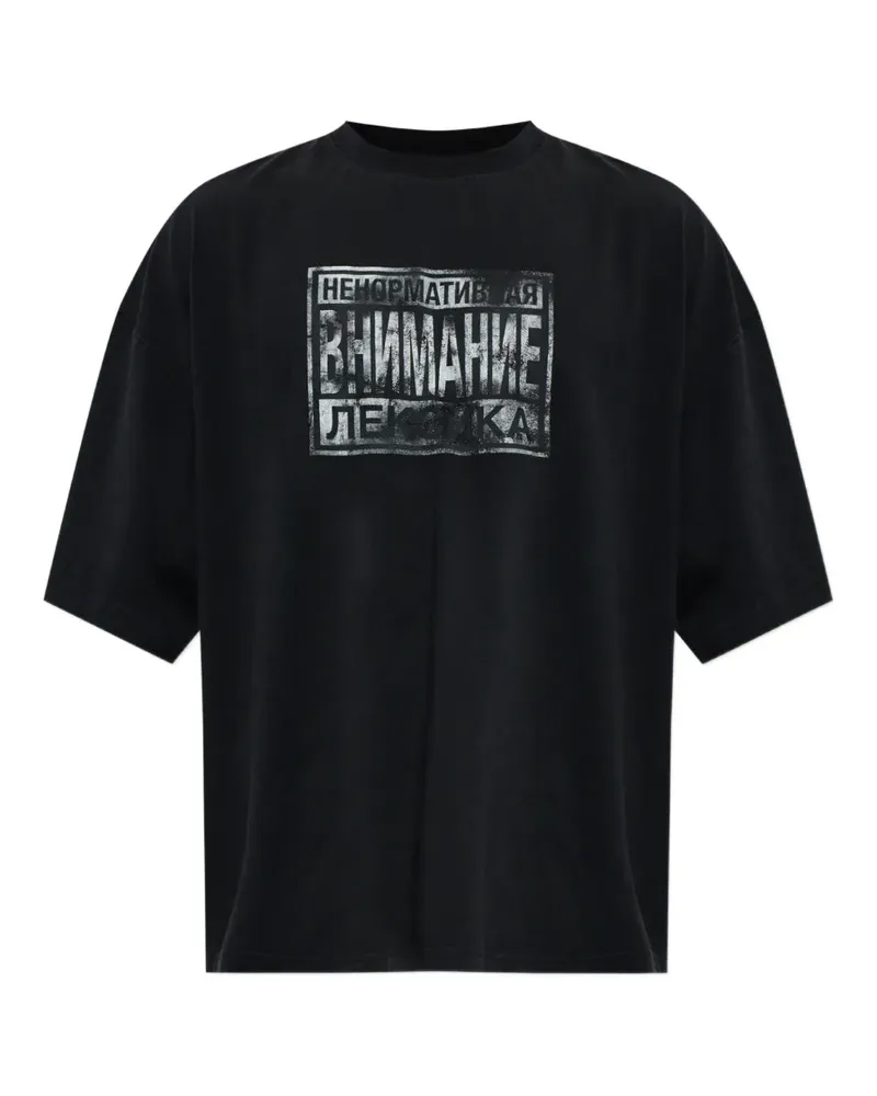 VETEMENTS slogan-print cotton T-shirt - Schwarz Schwarz