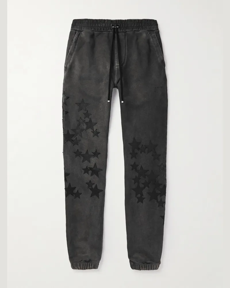Amiri Pigment Spray Star schmal zulaufende Jogginghose aus Baumwoll-Jersey mit Lederbesätzen Schwarz