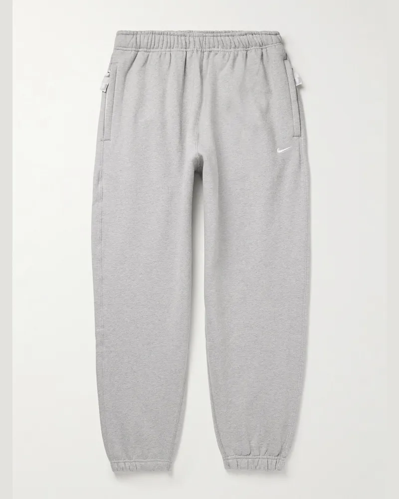 Nike Solo Swoosh schmal zulaufende Jogginghose aus Jersey aus einer Baumwollmischung mit Logostickerei Grau