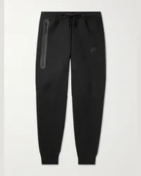 Nike Schmal zulaufende Jogginghose aus „Tech Fleece“-Material aus einer Baumwollmischung Schwarz