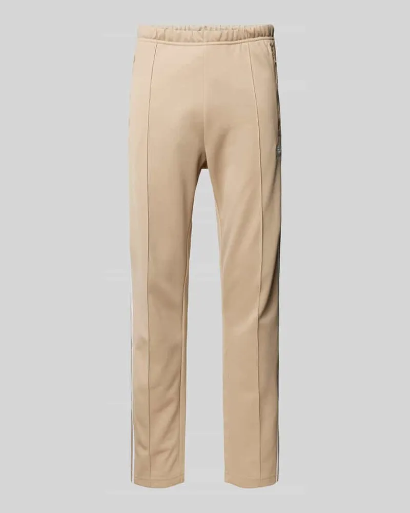 adidas Regular Fit Trainingshose mit Reißverschlusstaschen Beige