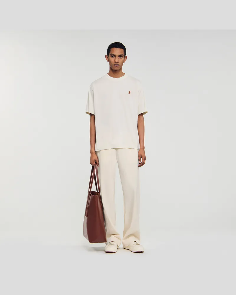 Sandro T-Shirt mit Leder-Logo Butter
