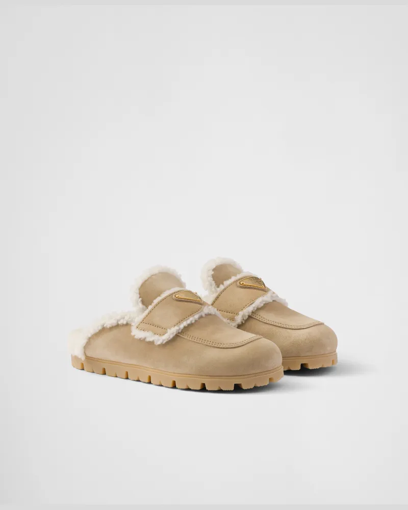 Prada Slipper aus Wildleder und Lammfell Ecru