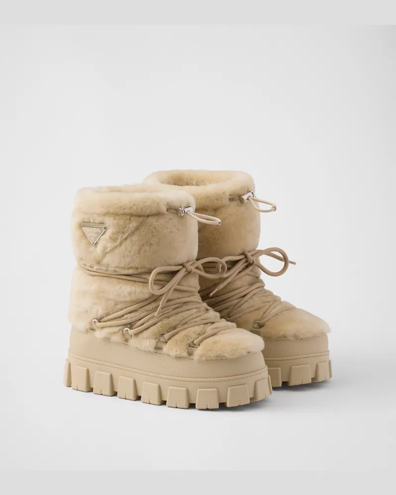 Prada Après-Ski-Stiefeletten aus Lammfell Ecru