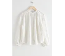 Voluminöse Bluse mit Blumenapplikation - Weiß