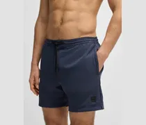 Men's Performance Logo Badge Swim Shorts Blue Clothing > Beachwear