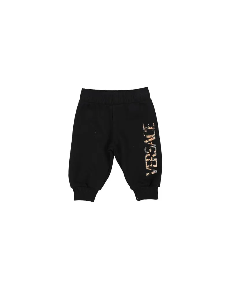 Versace HOSEN & RÖCKE - Hosenauf YOOX.COM Schwarz