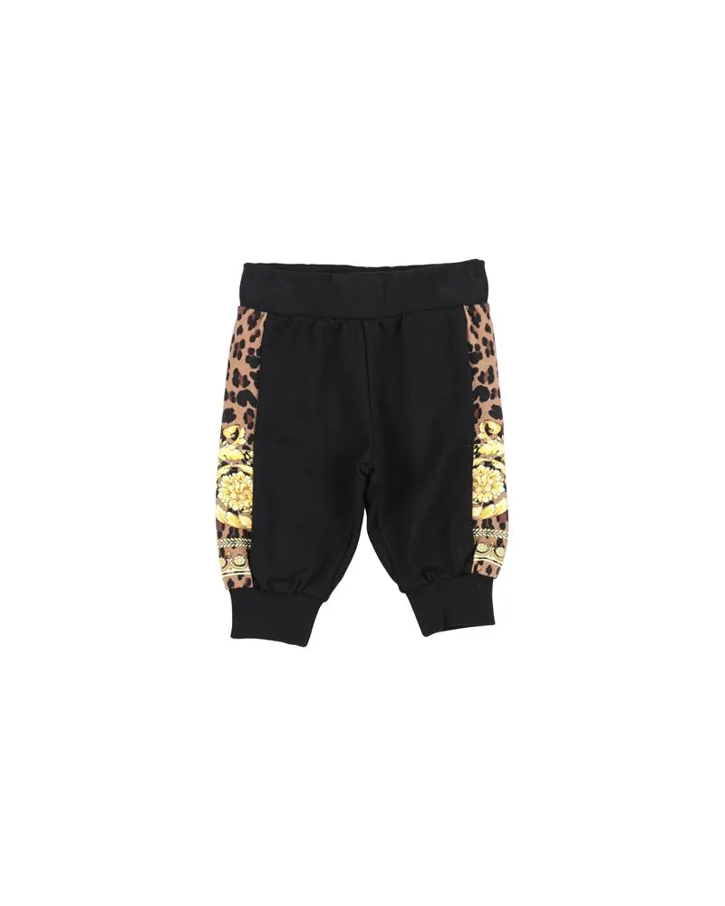 Versace HOSEN & RÖCKE - Hosenauf YOOX.COM Schwarz