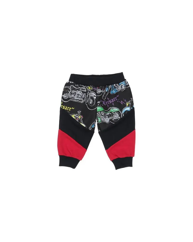 Versace HOSEN & RÖCKE - Hosenauf YOOX.COM Schwarz