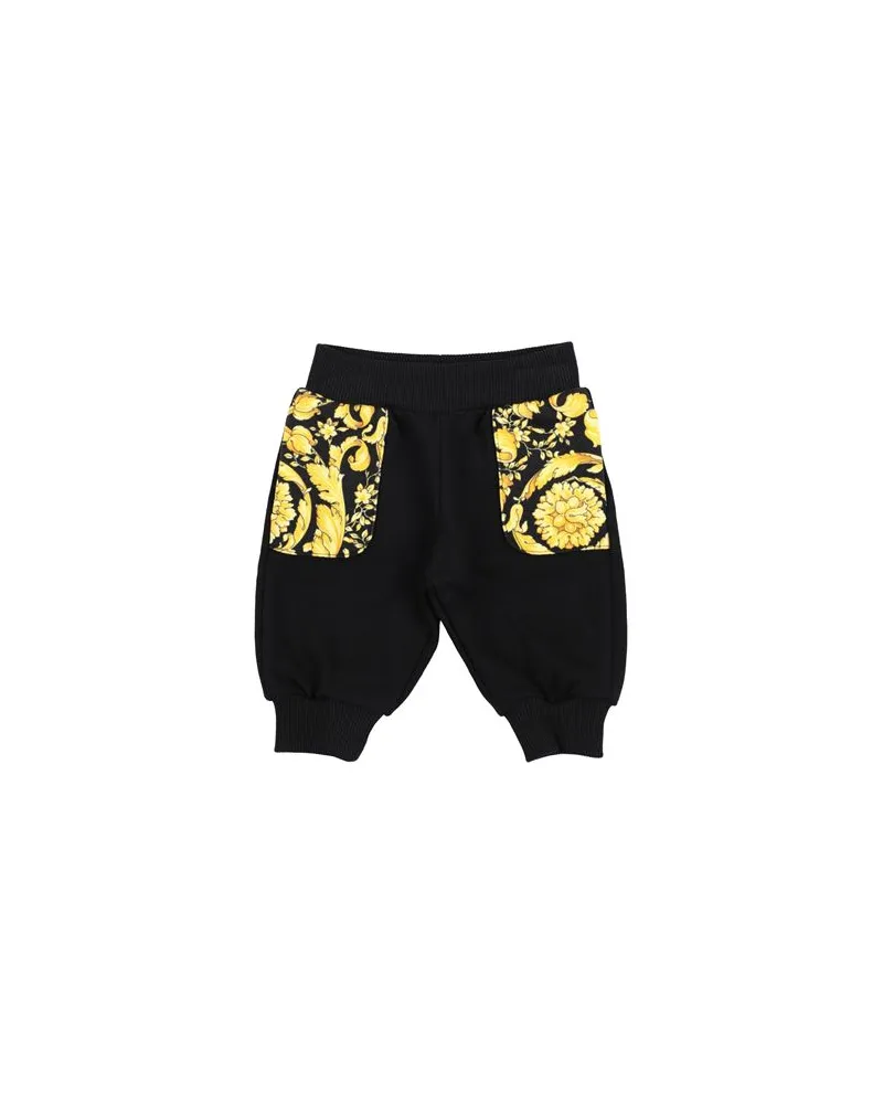 Versace HOSEN & RÖCKE - Hosenauf YOOX.COM Schwarz