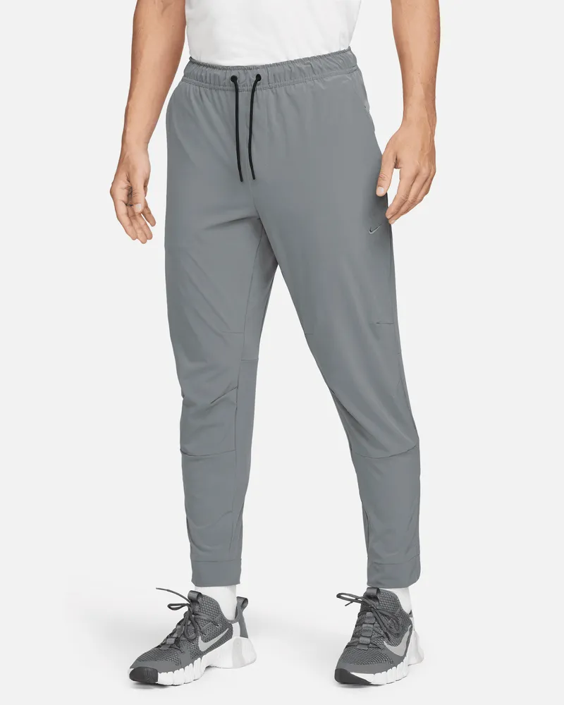 Nike Unlimited vielseitige Dri-FIT Hose mit Reißverschluss am Bündchen für Herren - Grau Grau