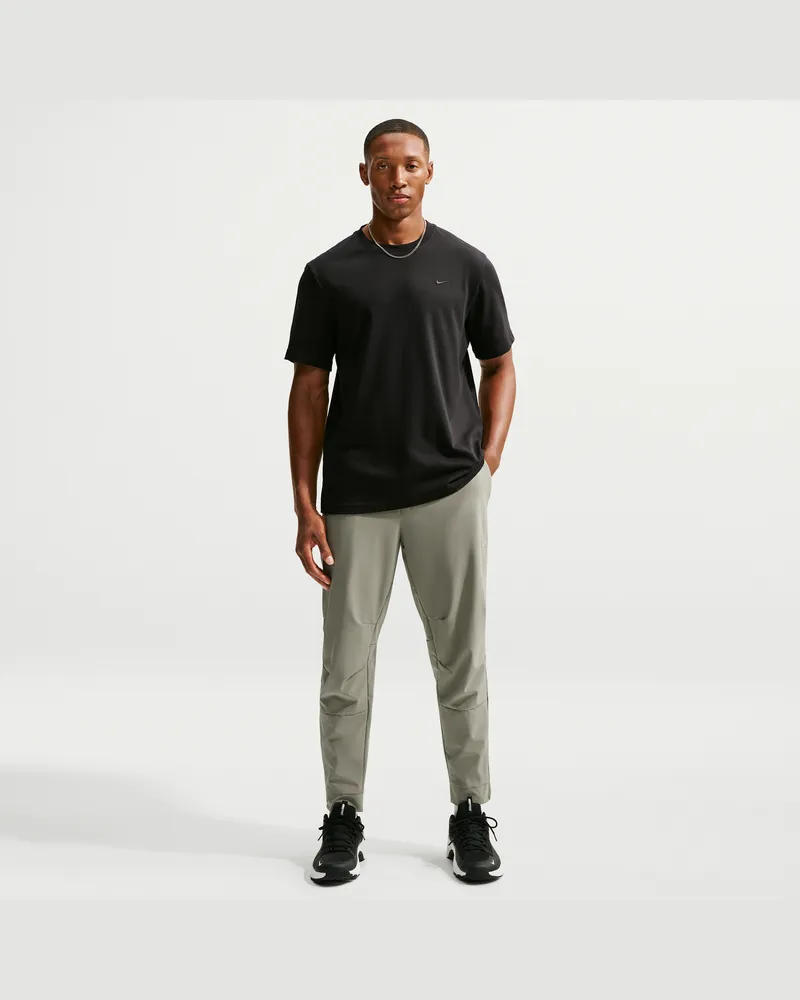 Nike Unlimited vielseitige Dri-FIT Hose mit Reißverschluss am Bündchen für Herren - Grün Grün