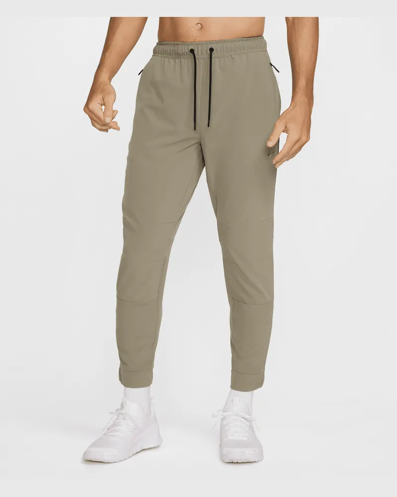 Nike Unlimited vielseitige Dri-FIT Hose mit Reißverschluss am Bündchen für Herren - Grün Grün