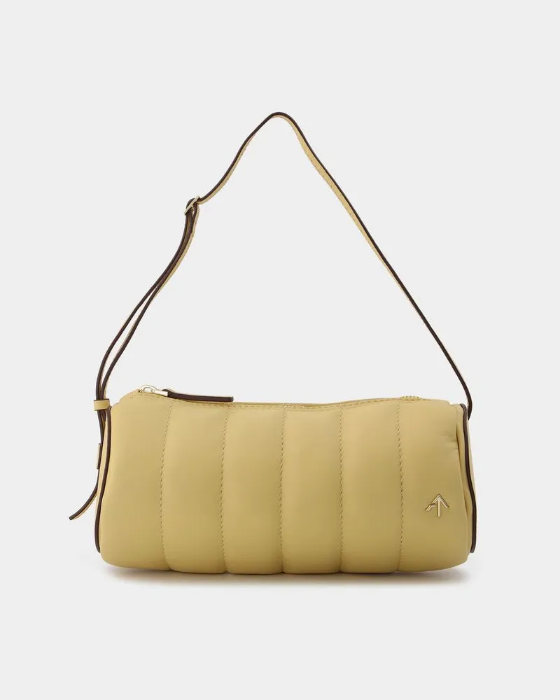 Manu Atelier Gepolsterte Zylindertasche aus cremefarbenem Leder Beige