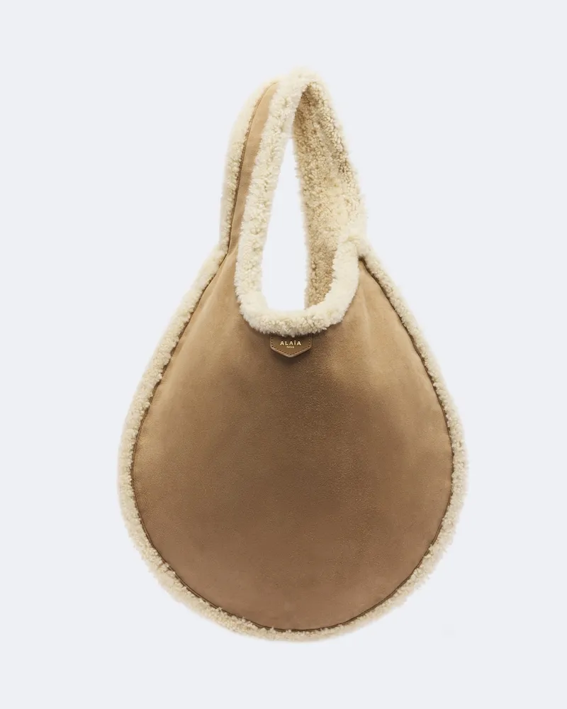 Alaïa Alaïa Schultertasche One Piece mit Shearling Beige