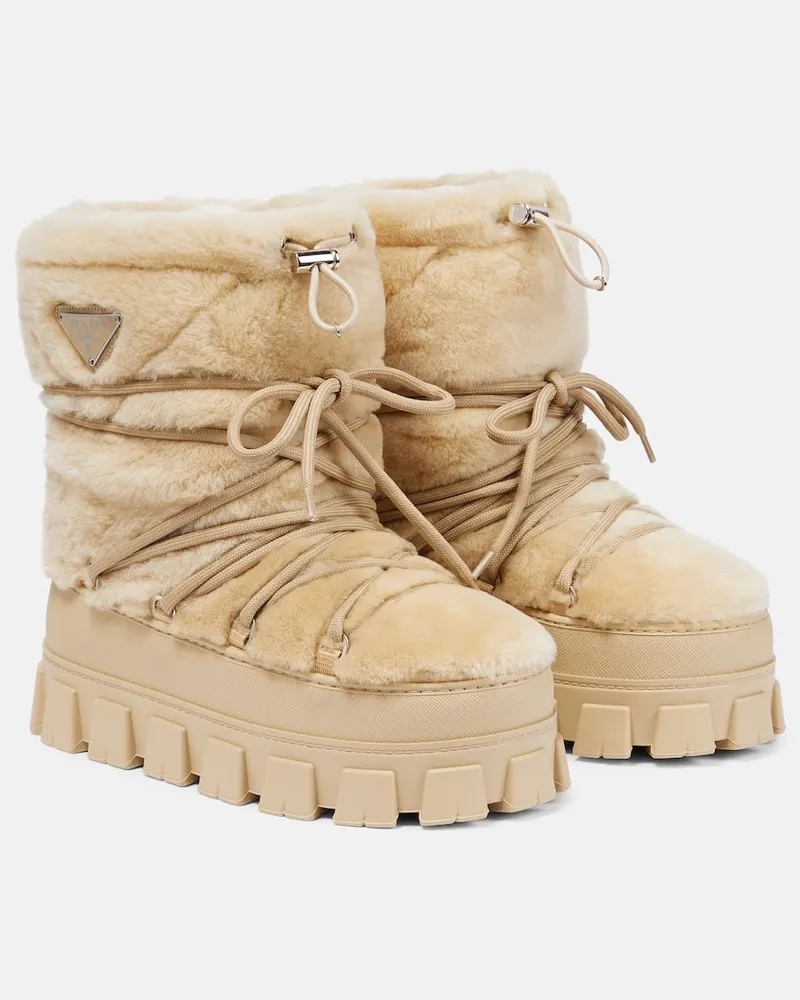 Prada Schneestiefel aus Shearling und Leder Beige