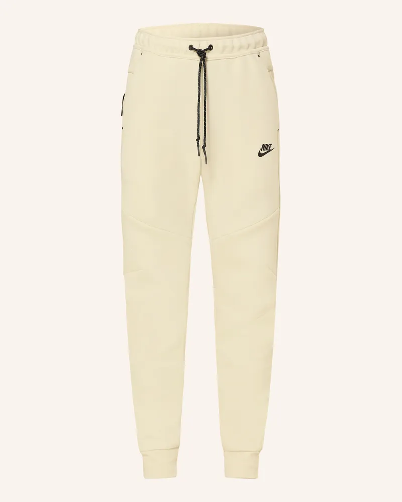 Nike Sweatpants Tech gruen Creme