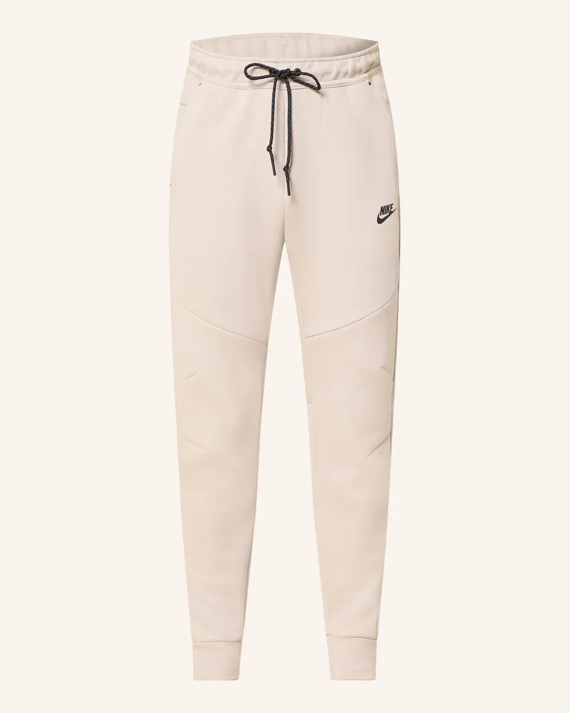 Nike Sweatpants Tech gruen Creme