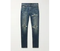 Jeans skinny effetto consumato con inserti MX1