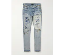 Jeans skinny patchwork effetto consumato con logo ricamato