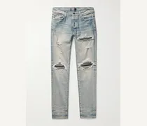 Jeans skinny effetto invecchiato con inserti MX1
