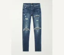 Jeans skinny effetto consumato MX1