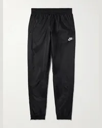 Nike Pantaloni sportivi a gamba affusolata in shell con logo ricamato Windrunner Nero