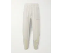 POST ARCHIVE FACTI Pantaloni a gamba affusolata in shell riciclato stretch con finiture in mesh