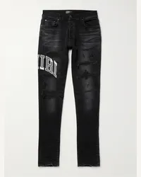 Amiri Jeans skinny effetto consumato con logo applicato e ricami Nero