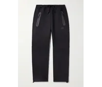 Pantaloni sportivi a gamba dritta in Tech Fleece di misto cotone con logo