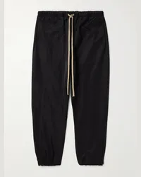 Fear of God Pantaloni sportivi a gamba affusolata in shell riciclato con logo applicato Nero