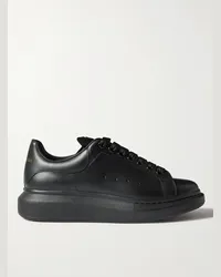 Alexander McQueen Sneakers in pelle con suola oversize e borchie Nero