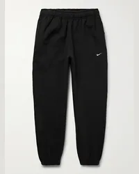 Nike Pantaloni sportivi a gamba affusolata in jersey di misto cotone con logo ricamato Solo Swoosh Nero