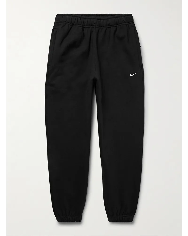 Nike Pantaloni sportivi a gamba affusolata in jersey di misto cotone con logo ricamato Solo Swoosh Nero