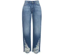 Jeans vita bassa in denim di cotone distressed