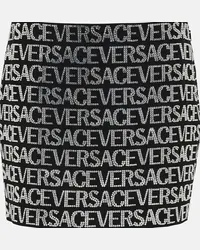 Versace Minigonna con logo e decorazioni Nero